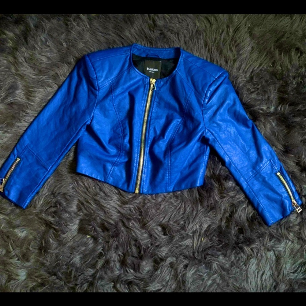 A leather blue Bebe jacket never worn new w/o tags